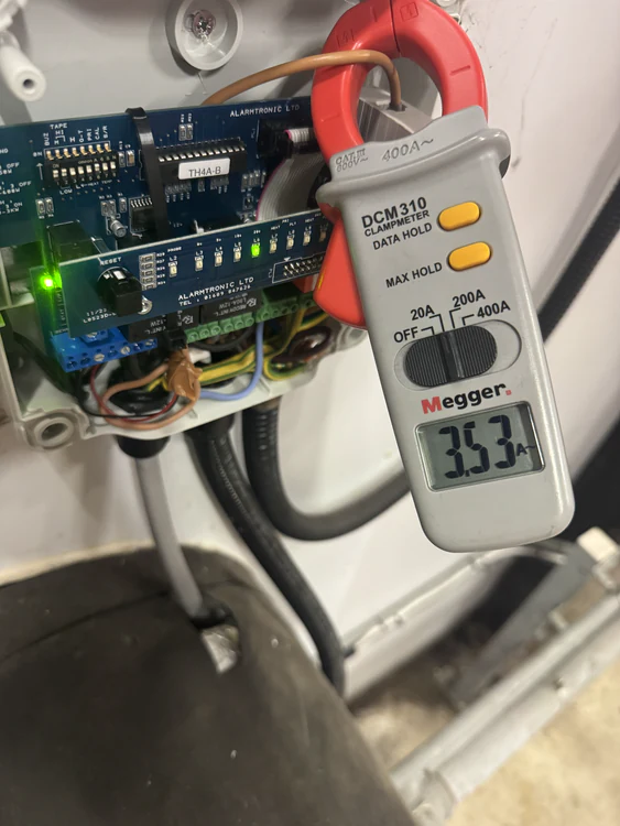 Megger clamp meter recording current draw from a fire system control board during testing