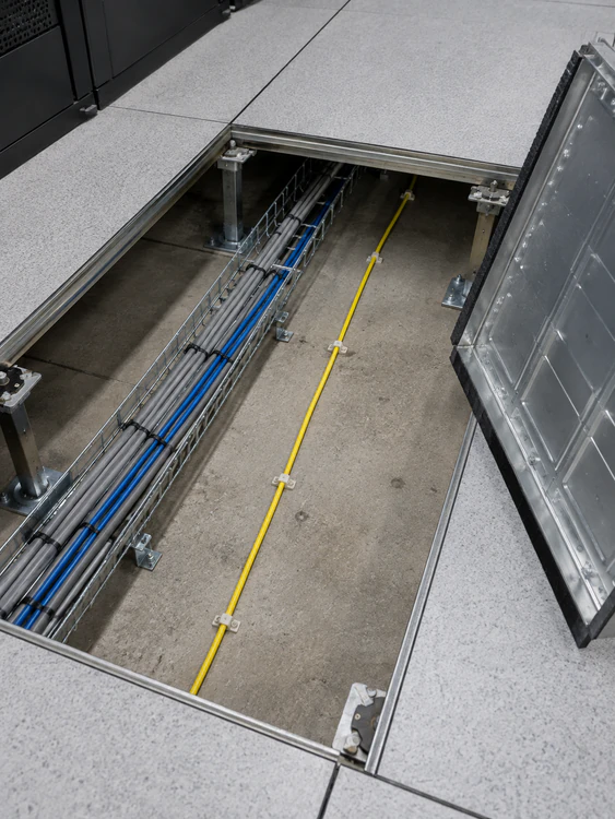 Water leak detection sense cable in a raised access floor void in a comms room
