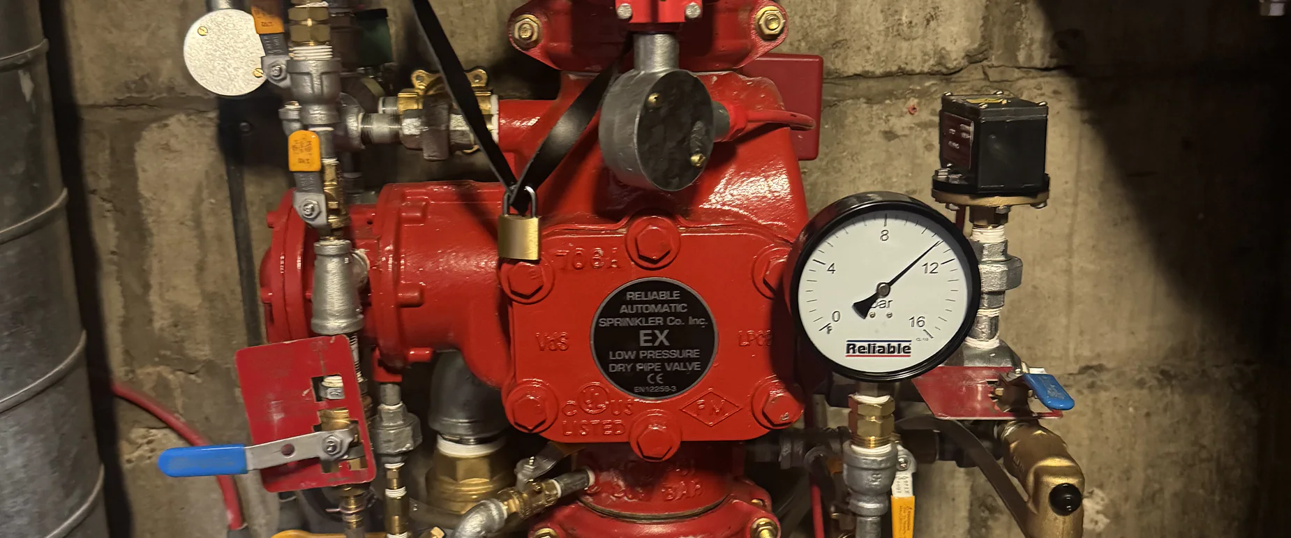 Reliable low pressure dry pipe valve with air and water pressure gauges on a pre-action sprinkler installation
